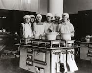 Cooking class in the school kitchen, 6 students at one stove